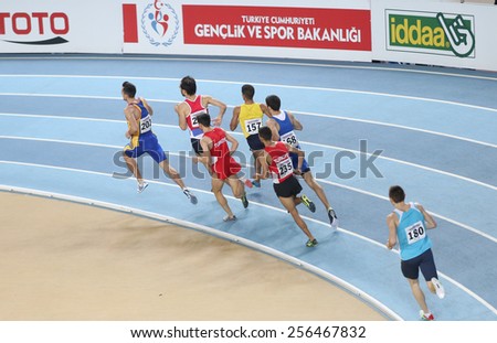 ISTANBUL, TURKEY - FEBRUARY 21, 2015: Athletes running during Balkan Athletics Indoor Championships in Asli Cakir Alptekin Athletics hall.
