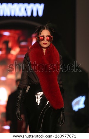 ISTANBUL, TURKEY - MARCH 18, 2015: A model showcases one of the latest creations by Hakan Akkaya in Mercedes-Benz Fashion Week Istanbul