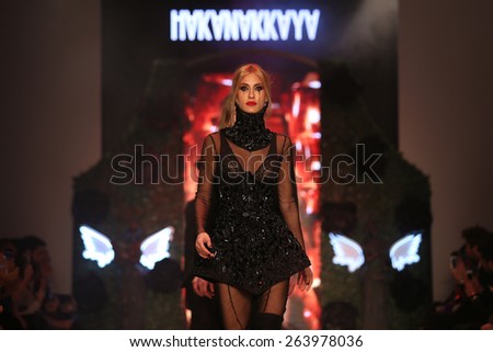 ISTANBUL, TURKEY - MARCH 18, 2015: Turkish model Cagla Sikel showcases one of the latest creations by Hakan Akkaya in Mercedes-Benz Fashion Week Istanbul