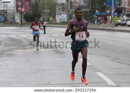 ISTANBUL, TURKEY - APRIL 26, 2015: Athlete is running in Old Town streets of Istanbul during Vodafone 10th Istanbul Half Marathon