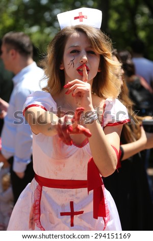 ISTANBUL, TURKEY - MAY 10, 2015: A girl in nurse costume during zombie walk Istanbul in Nisantasi Park