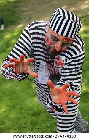ISTANBUL, TURKEY - MAY 10, 2015: Man in convict costume during zombie walk Istanbul in Nisantasi Park