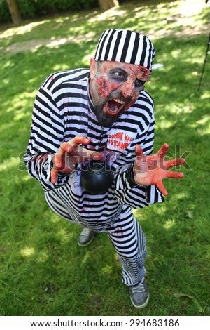ISTANBUL, TURKEY - MAY 10, 2015: Man in convict costume during zombie walk Istanbul in Nisantasi Park