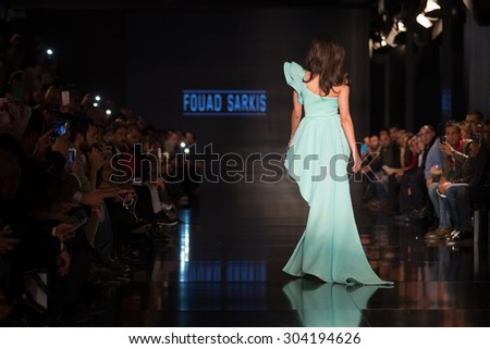 ISTANBUL, TURKEY - NOVEMBER 22, 2014: A model showcases one of the latest creations by Fouad Sarkis in Fashionist fashion fair