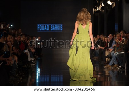 ISTANBUL, TURKEY - NOVEMBER 22, 2014: A model showcases one of the latest creations by Fouad Sarkis in Fashionist fashion fair