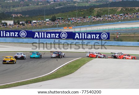 ISTANBUL - MAY 08: Cars navigate the fourth turn during the Porsche Mobil 1 Supercup Race 2 in Istanbul Park on May 08, 2011 in Istanbul, Turkey
