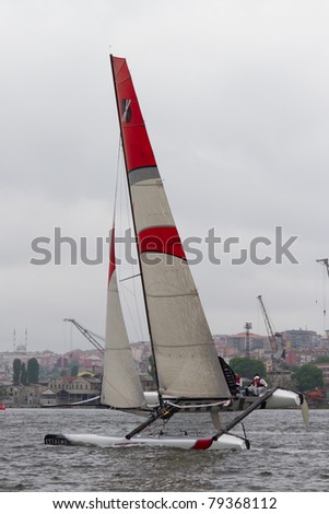 ISTANBUL - MAY 28: Skipper Tanguy Cariou, Alinghi Team boat competes in the Extreme Sailing Series, on May 28, 2011 Istanbul, Turkey.