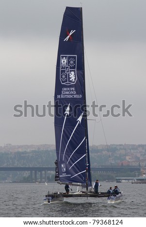 ISTANBUL - MAY 28: Skipper Pierre Pennec, Groupe Edmond De Rothschild team boat competes in the Extreme Sailing Series, on May 28, 2011 Istanbul, Turkey.