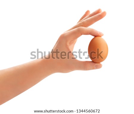 Similar – Foto Bild Hand hält ein Ei mit gemaltem Gesicht darauf. Ostern.