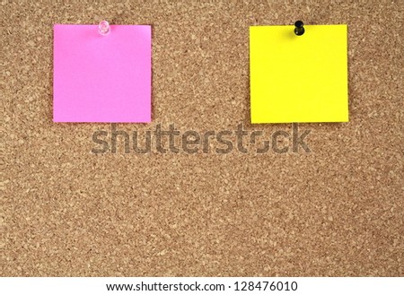 Notice papers on cork board