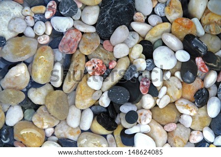 Pebble stones in crystal clear water