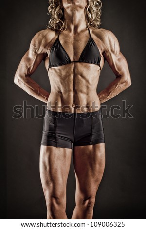 Very Fit and Toned Female BodyBuilder showing her Ads