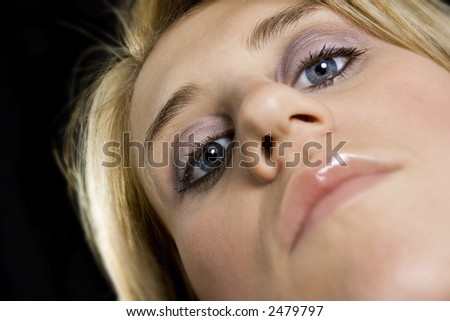 Closeup of blond woman\'s face & eyes