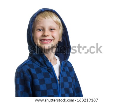 Portrait of a cute and happy young boy with missing front teeth in a blue hoodie isolated on white with copy-space