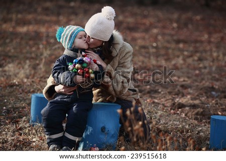 son kissing his mother for holiday gifts