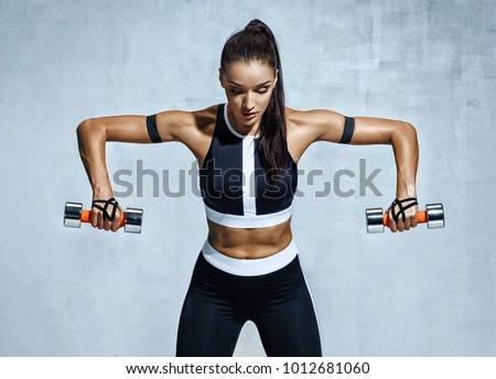 Image, Stock Photo Athletic woman doing triceps push-ups with a barbell plate