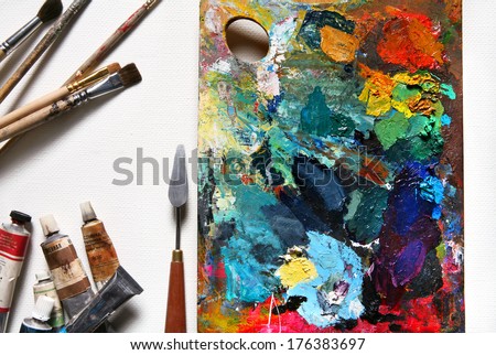 Artwork oil painting and accessories / studio photography of paint utensils on black background