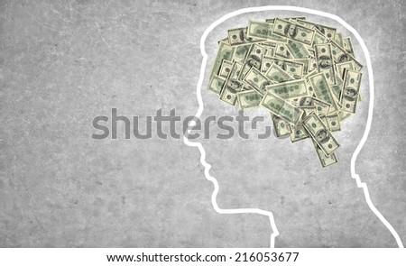 Brain currency / outline of a man\'s head with the brain in the shape of money