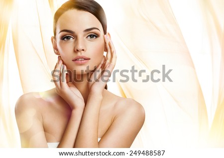 Beautiful girl with beautiful makeup, youth and skin care concept / photoset of attractive brunette girl on beige background