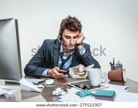 Trifle away one\'s time / modern office man at working place, sloth and laziness at work concept