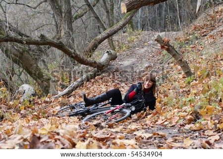 Young female bicycle rider down smiling