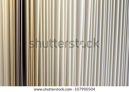 Closeup of vintage open book paper sheets texture background