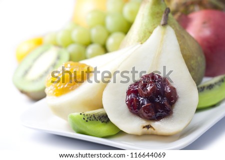 Fruits and pears with jam closeup luxury food concept on white