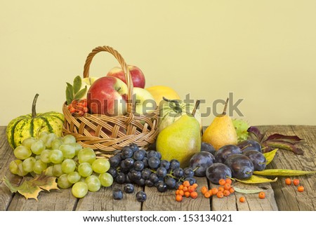 Fruits and vegetables in autumn season on vintage wooden boards