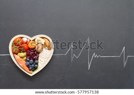 Healthy food in heart and cardiograph on blackboard medical abstract concept 商業照片 © 
