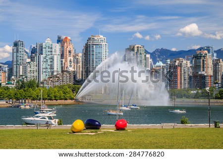VANCOUVER, CANADA - JUNE 05, 2015: Unidentified people watch False Creek pump station test in Vancouver. Pump station supplies water for firefighting purposes via a network of water mains and hydrants