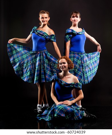 Group of dancers of the Scottish dance in kilts
