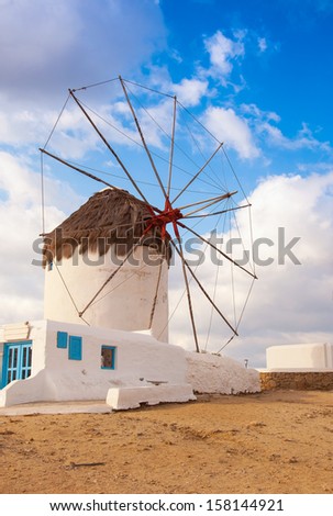 Windmill on a hill near the sea on the island of Mykonos - a place that must attend