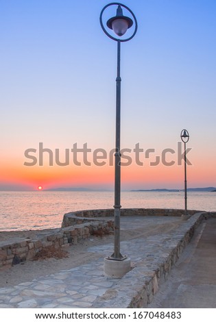 Port street lights at sunset. Mykonos. Greece.