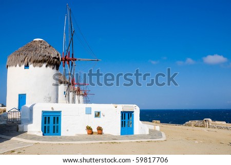 Windmills on a hill near the sea on the island of Mykonos - a famous place that must attend