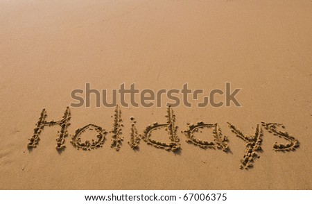 The inscription on the sand - holidays, vacation paradise