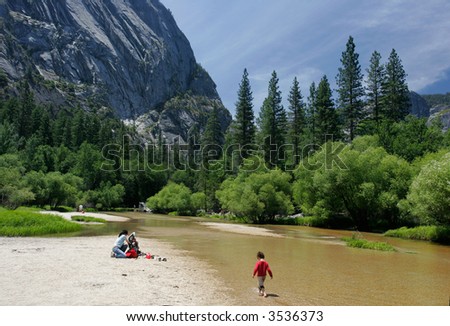 3 Years old hiking in Merced River going to Mirror Lake in Yosemite