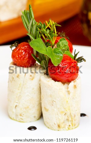 Mashed potatoes with pickled tomatoes with herbs. Creative cuisine.