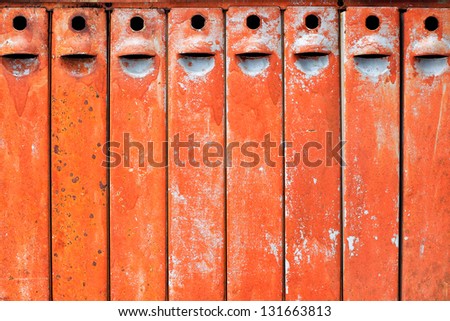 Old metal boxes for letters with peeled paint and rust