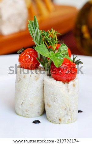 Mashed potatoes with pickled tomatoes with herbs, selective focus. Creative cuisine.