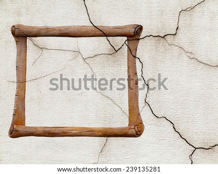 Decorative frame, sculpture in the form of an ancient scroll on background old cracked walls of the building for any of your design