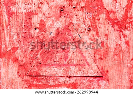 Creative background metal triangle cracks and scratches carelessly painted with red paint. Textured background for your concept or project. Great background or texture.