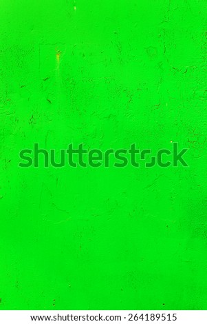 Bright background old damaged wall with cracks, scratches, painted with green paint. Textured background for your concept or project. Great background or texture.