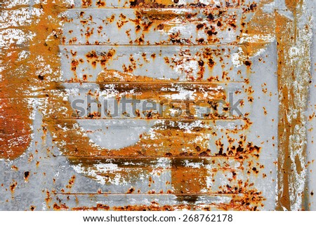 Creative background of rusty metal with cracks and scratches, carelessly painted paint. Grungy metal surface. Great background or texture for your project.