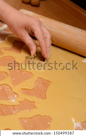 Christmas bakery background with baking tin, cut out some cookies