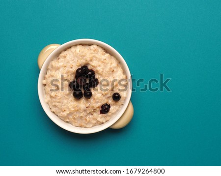 Similar – Image, Stock Photo Hot porridge with frozen blueberries