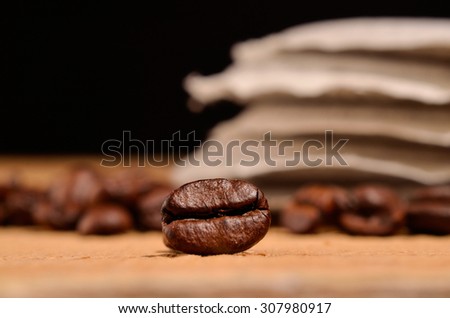 Close up of an espresso bean on a table with coffee pads