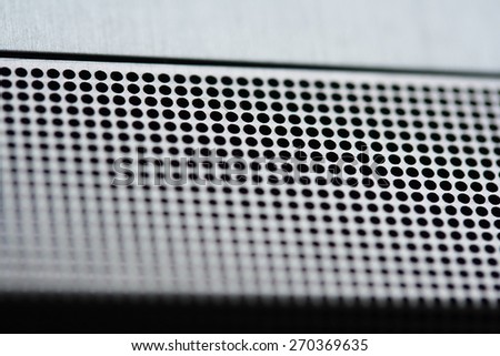 Hi-tech abstract background. The perforated metal texture.