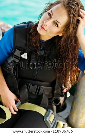 beautiful woman checking diving. dive equipment