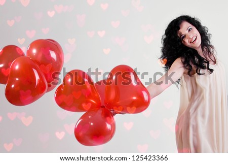woman with red heart balloon on a white background
