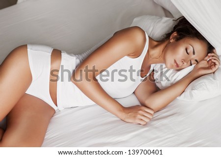 Portrait of a young girl sleeping on a pillow